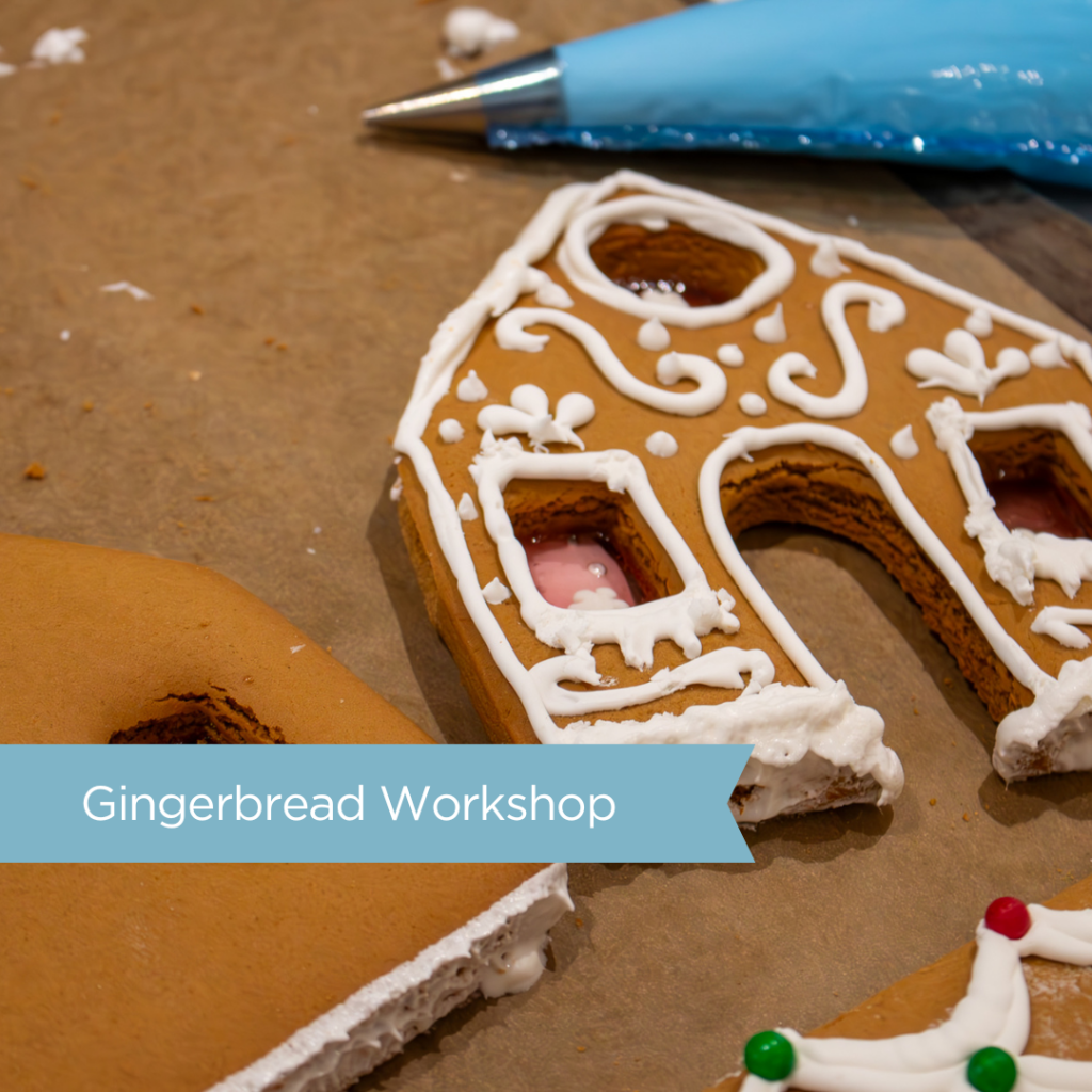 gingerbread house being decorated with royal white icing